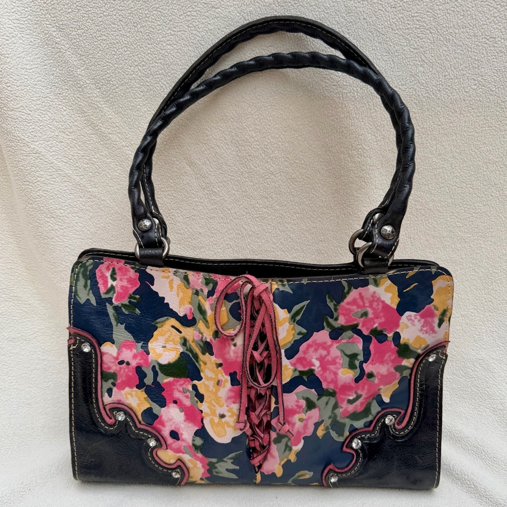 PATRICIA NASH vintage leather bag. Floral print and corset-style front lacing.